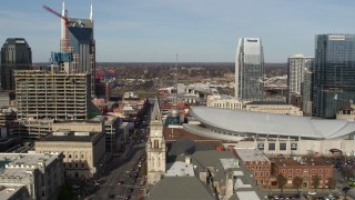 DX0002_119_010 - 5.7K aerial stock footage of Broadway and Bridgestone Arena, Downtown Nashville, Tennessee
