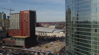 DX0002_119_017 - 5.7K aerial stock footage of Cambria Hotel and Bridgestone Arena during descent, Downtown Nashville, Tennessee