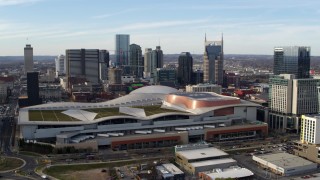 DX0002_119_020 - 5.7K stock footage aerial video fly away from Nashville Music City Center and city's skyline, Downtown Nashville, Tennessee
