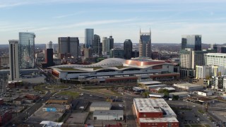 DX0002_119_021 - 5.7K aerial stock footage ascend and flyby Nashville Music City Center and city's skyline, Downtown Nashville, Tennessee