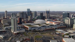 DX0002_119_022 - 5.7K aerial stock footage passing by Nashville Music City Center and city's skyline, Downtown Nashville, Tennessee