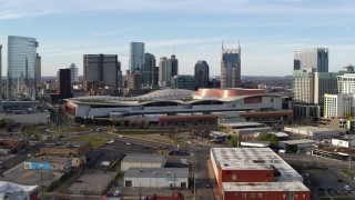 DX0002_119_026 - 5.7K aerial stock footage approach Nashville Music City Center and city's skyline during ascent, Downtown Nashville, Tennessee