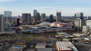 DX0002_119_030 - 5.7K aerial stock footage reverse view of Nashville Music City Center and city's skyline during descent, Downtown Nashville, Tennessee