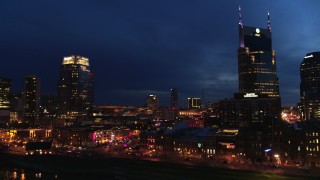 DX0002_121_007 - 5.7K aerial stock footage orbit Broadway and AT&T Building at twilight, reveal Pinnacle skyscraper, Downtown Nashville, Tennessee