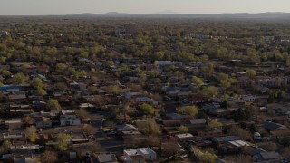 DX0002_122_013 - 5.7K aerial stock footage of a wide orbit of an urban neighborhood in Albuquerque, New Mexico