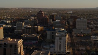 DX0002_122_029 - 5.7K stock footage aerial video ascend near  courthouse for view of office high-rises in Downtown Albuquerque, New Mexico