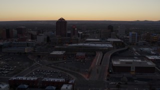 DX0002_123_008 - 5.7K aerial stock footage flyby Albuquerque Plaza and Hyatt Regency at sunset near office high-rises, Downtown Albuquerque, New Mexico