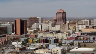 DX0002_124_024 - 5.7K aerial stock footage of Albuquerque Plaza office high-rise and neighboring buildings, Downtown Albuquerque, New Mexico