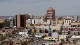 DX0002_124_025 - 5.7K aerial stock footage of Albuquerque Plaza office high-rise and surrounding buildings, Downtown Albuquerque, New Mexico