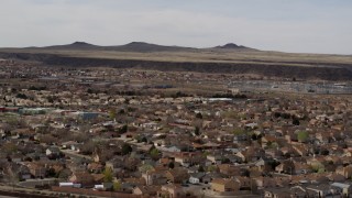 DX0002_126_018 - 5.7K stock footage aerial video of descend past suburban neighborhood, reveal freeway, Albuquerque, New Mexico