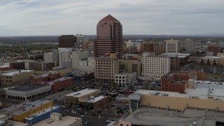 DX0002_127_003 - 5.7K aerial stock footage orbiting the Albuquerque Plaza and neighboring city buildings, Downtown Albuquerque, New Mexico