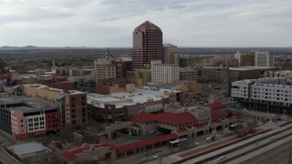 DX0002_127_007 - 5.7K aerial stock footage orbit Albuquerque Plaza high-rise and neighboring city buildings, Downtown Albuquerque, New Mexico