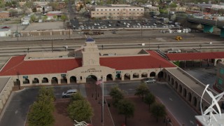 DX0002_127_017 - 5.7K aerial stock footage of orbiting the Albuquerque train station, Downtown Albuquerque, New Mexico