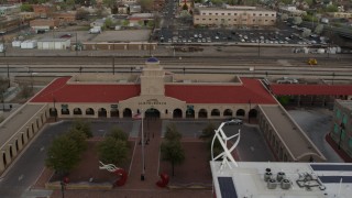 DX0002_127_021 - 5.7K aerial stock footage of the entrance of the Albuquerque train station, Downtown Albuquerque, New Mexico