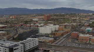 DX0002_127_026 - 5.7K aerial stock footage of passing office and apartment buildings, Downtown Albuquerque, New Mexico
