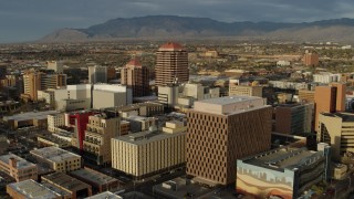 DX0002_127_033 - 5.7K aerial stock footage flyby federal building, focus on Albuquerque Plaza high-rise, Downtown Albuquerque, New Mexico