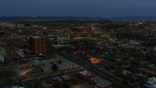 DX0002_128_016 - 5.7K aerial stock footage orbit hospital and reveal a medical center at twilight, Albuquerque, New Mexico