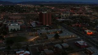 DX0002_128_017 - 5.7K aerial stock footage orbit medical center at twilight, Albuquerque, New Mexico
