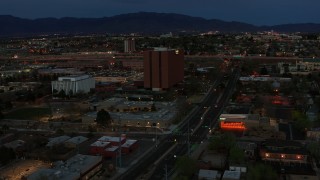 DX0002_128_018 - 5.7K aerial stock footage orbit around medical center at twilight, then approach, Albuquerque, New Mexico