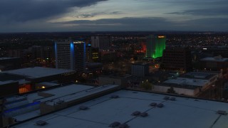 DX0002_128_024 - 5.7K aerial stock footage approach and flyby hotel and office buildings at twilight, Downtown Albuquerque, New Mexico