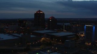 DX0002_128_026 - 5.7K aerial stock footage orbit office high-rise, hotel and Kiva Auditorium at twilight, Downtown Albuquerque, New Mexico