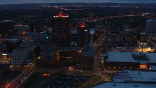 DX0002_128_029 - 5.7K aerial stock footage orbit office high-rise and hotel at twilight, Downtown Albuquerque, New Mexico