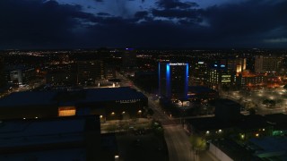 DX0002_128_042 - 5.7K aerial stock footage flyby auditorium, hotel and reveal office building at twilight, Downtown Albuquerque, New Mexico