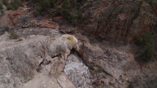 DX0002_129_006 - 5.7K aerial stock footage bird's eye view of river rapids flowing through a rock formation in the mountains in New Mexico