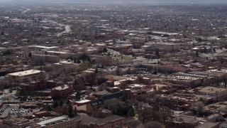 DX0002_129_028 - 5.7K aerial stock footage flying past city buildings in the downtown area of Santa Fe, New Mexico