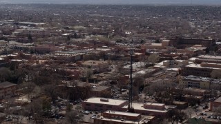 DX0002_129_030 - 5.7K aerial stock footage flying by Radio Plaza in the city's downtown area, Santa Fe, New Mexico