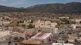DX0002_130_006 - 5.7K aerial stock footage fly away from Bataan Memorial Building near capitol, Santa Fe, New Mexico