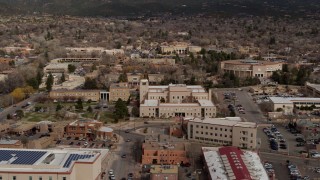 DX0002_130_008 - 5.7K aerial stock footage fly away from Bataan Memorial Building and state capitol building, Santa Fe, New Mexico