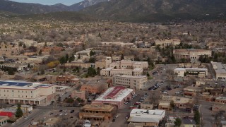 DX0002_130_009 - 5.7K aerial stock footage descend and focus on Bataan Memorial Building near state capitol building, Santa Fe, New Mexico