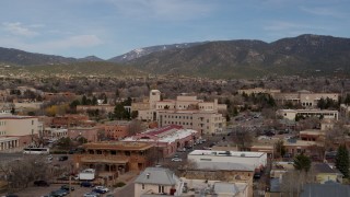 DX0002_130_011 - 5.7K aerial stock footage an orbit of state government offices and shops, state capitol in background, Santa Fe, New Mexico