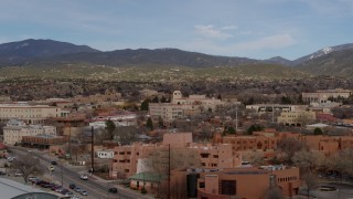 DX0002_130_013 - 5.7K aerial stock footage flyby shops and downtown buildings, focus on Bataan Memorial Building in Santa Fe, New Mexico