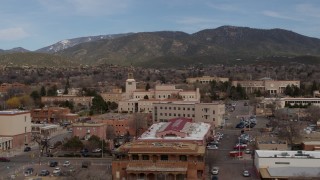 DX0002_130_014 - 5.7K aerial stock footage circling Bataan Memorial Building near the state capitol in Santa Fe, New Mexico