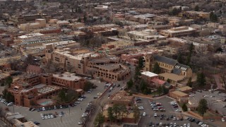 DX0002_130_028 - 5.7K aerial stock footage of orbiting two hotels and cathedral in Santa Fe, New Mexico