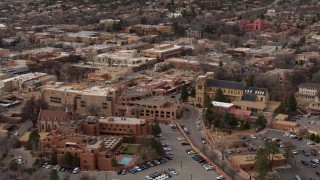 DX0002_130_029 - 5.7K aerial stock footage of circling two hotels and a cathedral in Santa Fe, New Mexico