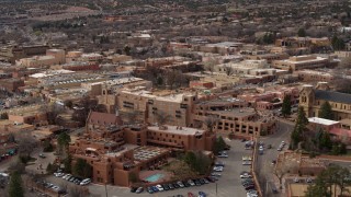 DX0002_130_033 - 5.7K aerial stock footage flyby hotels to reveal a cathedral in Santa Fe, New Mexico