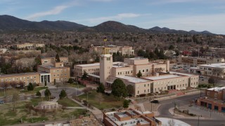 DX0002_131_001 - 5.7K aerial stock footage of closely orbiting the Bataan Memorial Building in Santa Fe, New Mexico