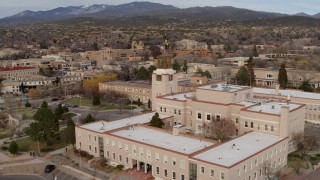 DX0002_131_004 - 5.7K aerial stock footage of a reverse view of the Bataan Memorial Building in Santa Fe, New Mexico