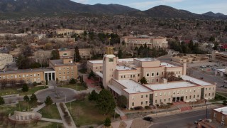 DX0002_131_006 - 5.7K aerial stock footage approach the Bataan Memorial Building, capitol in background in Santa Fe, New Mexico