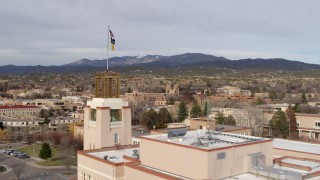 DX0002_131_018 - 5.7K aerial stock footage flyby Bataan Memorial Building to reveal downtown, Santa Fe, New Mexico
