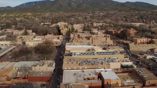 DX0002_131_025 - 5.7K aerial stock footage approach Santa Fe Plaza, cathedral and hotel, Santa Fe, New Mexico