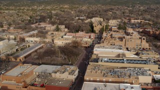 DX0002_131_026 - 5.7K aerial stock footage reverse view of Santa Fe Plaza, cathedral and San Francisco Street, Santa Fe, New Mexico