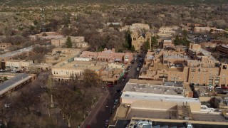 DX0002_131_028 - 5.7K aerial stock footage flyby Santa Fe Plaza to approach the cathedral in Santa Fe, New Mexico