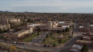 DX0002_131_034 - 5.7K aerial stock footage orbit the Bataan Memorial Building before descending, Santa Fe, New Mexico