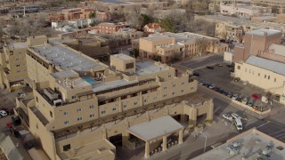 DX0002_131_038 - 5.7K aerial stock footage fly away from and orbit the Eldorado Hotel & Spa hotel, Santa Fe, New Mexico