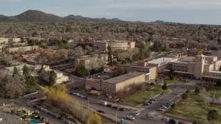 DX0002_131_041 - 5.7K aerial stock footage orbit and fly away from state capitol, revealing Bataan Memorial Building, Santa Fe, New Mexico