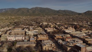 DX0002_132_008 - 5.7K aerial stock footage slowly passing by downtown buildings around Santa Fe Plaza, Santa Fe, New Mexico